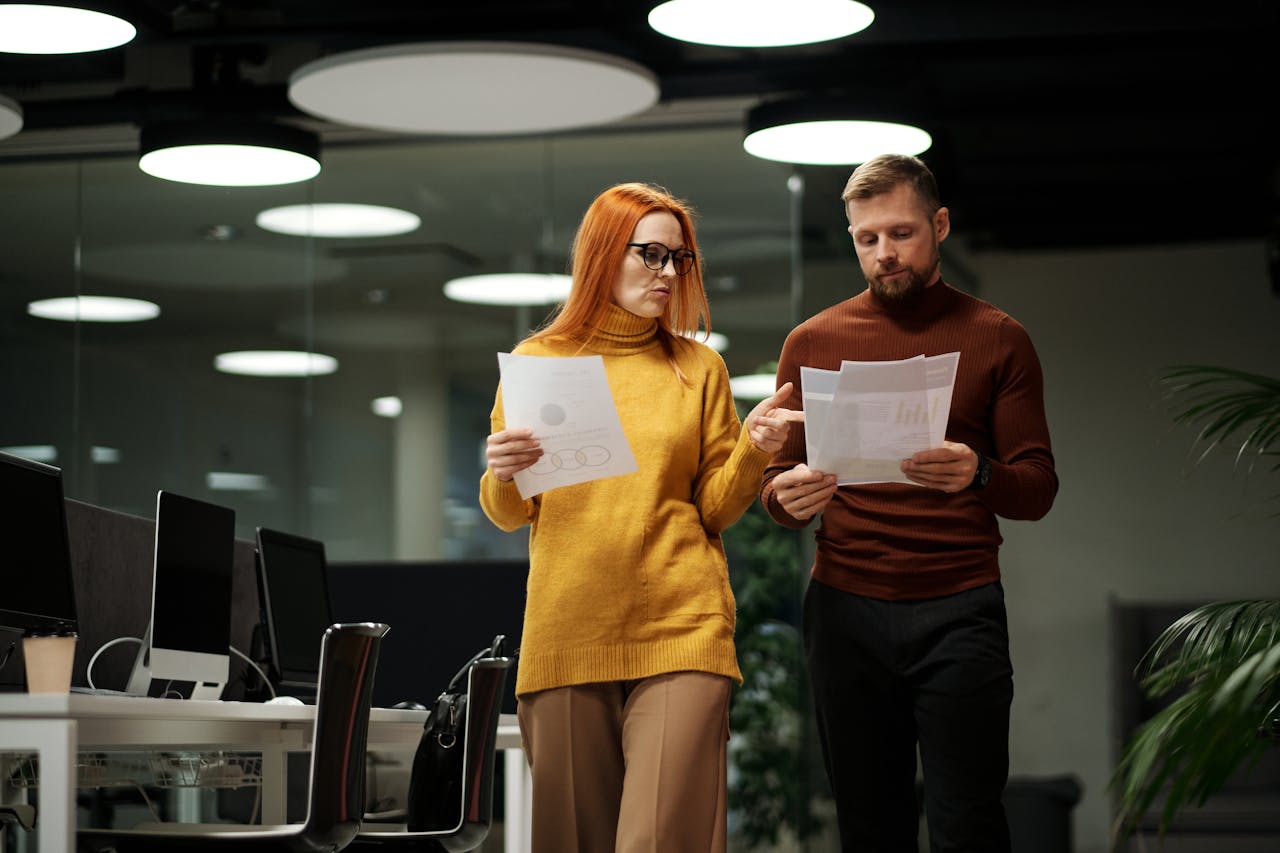 Female & male finance workers in office